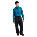 Man wearing black Burton AK Cyclic Gore-Tex 2L Snowboard Pants and a blue fleece top