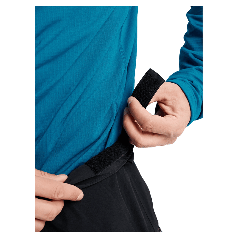 Detail view of a man wearing the Burton AK Cyclic Gore-Tex 2L Snowboard Pants in Black