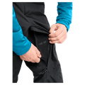 Detail view of a man wearing the Burton AK Cyclic Gore-Tex 2L Snowboard Pants in Black
