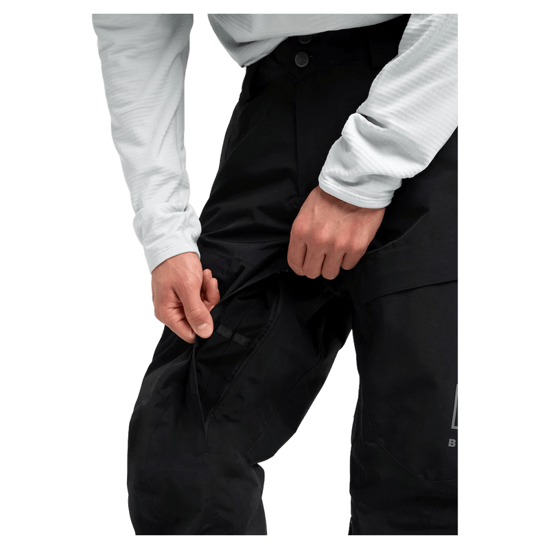 Detailed cropped view of a man wearing the Burton AK Swash Gore-Tex 2L Snowboard Pants in black