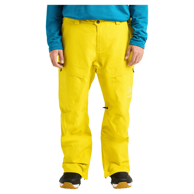 Front cropped view of a man wearing the Burton AK Swash Gore-Tex 2L Snowboard Pants in Yellow