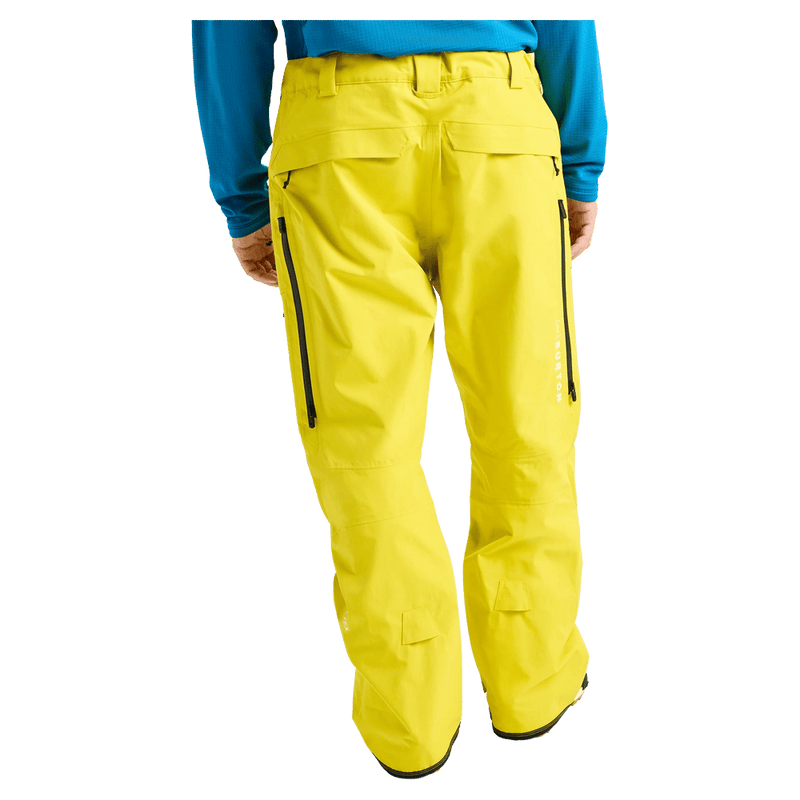 Rear cropped view of a man wearing the Burton AK Swash Gore-Tex 2L Snowboard Pants in yellow