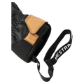 Close-up of black and tan leather Hestra glove cuff showing the Velcro closure and branded elastic wrist leash in colour Black