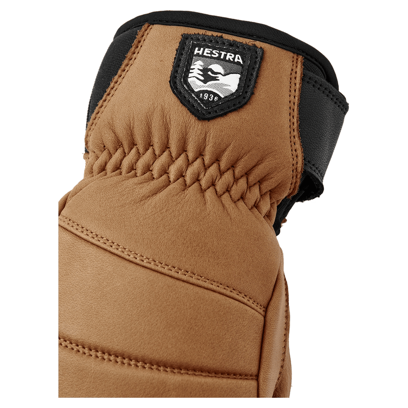 Hestra Leather Fall Line glove with elastic wrist, black logo patch, and neoprene cuffin colour Cork.