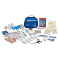 Contents laid out of the Adventure Medical Kits Explorer First Aid Kit showing the carry pouch, gloves, scissors, bandages, manual, tweezers, wipes etc.