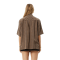 Back view of woman wearing Afends Hometown Short Sleeve Shirt in coffee colorway