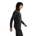 Cropped side view of a man wearing the Arcteryx Rho LT Zip Neck in Black
