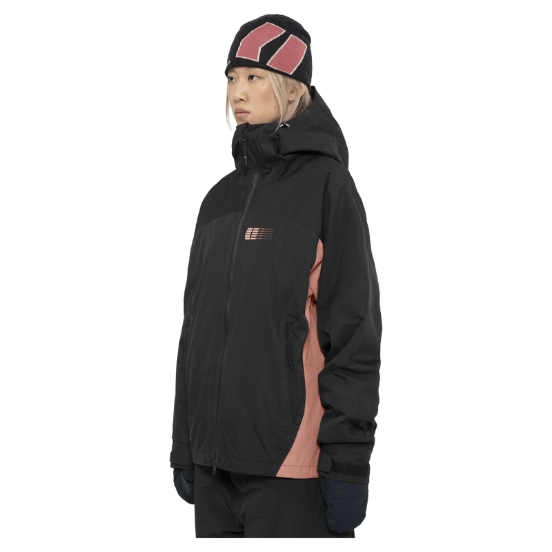 Side view of the Armade Ansel 2L Shell Jacket in Black and Faded Rose colourway, unisex's model