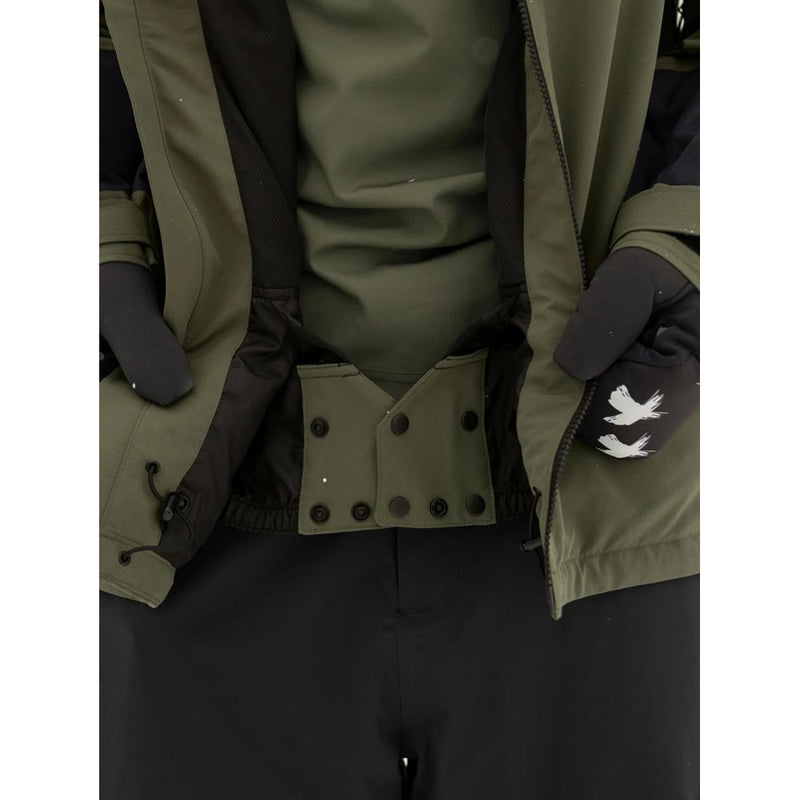 Powder skirt view of the Armada Bargs 2L Insulated Jacket in Olive colourway, unisex's model