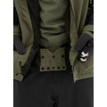 Powder skirt view of the Armada Bargs 2L Insulated Jacket in Olive colourway, unisex's model