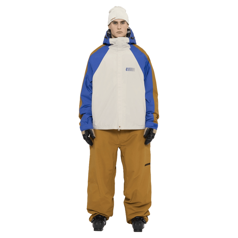 Full-body view of the Armada Gansett 2L Insulated Jacket in cream, dazzler and golden brown colourway, unisex's model