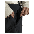 Pocket view of the Armada Team Issue 2L Cargo Pant in Black colourway, men's model