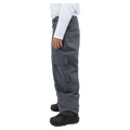 Side view of Beyond Medals dark grey cargo snowboard pants featuring a large side pocket and elasticated leg cuffs.