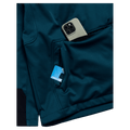Pocket view of the Burton Crown Riding Hoodie in Atlantic Teal colourway, unisex's model