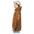 Side view of the Endeavor Ops Organic Hoodie in Clay colourway, unisex model