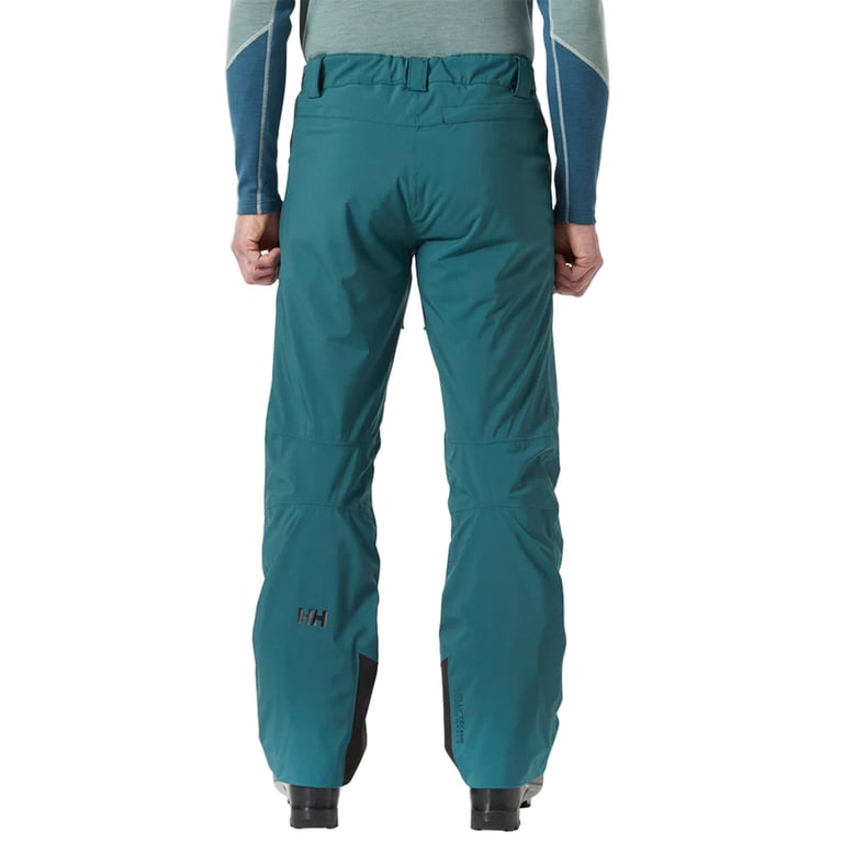 Rear view of teal Helly Hansen Legendary Insulated Ski Pants with belt loops and reinforced inner ankle patches.