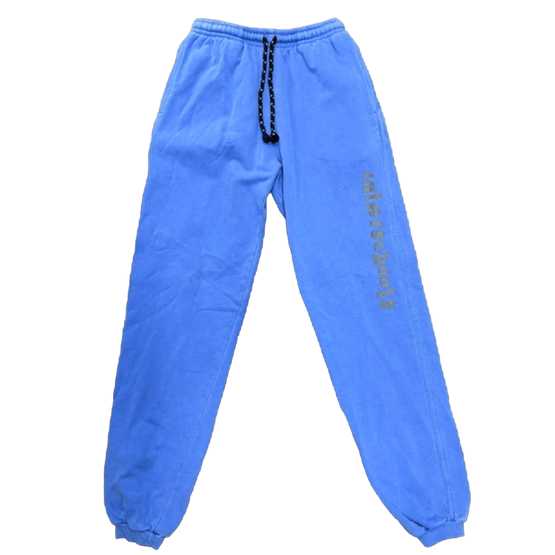 Blue Rhythm Snowsports Interschools track pants with elastic waistband, drawstring, and vertical leg graphic.