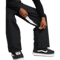 Black Volcom Kleveland snowboard pants showing a zippered inner thigh vent with white mesh lining.