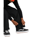 Volcom Kleveland black snowboard pants featuring adjustable snap and zipper cuffs with internal boot gaiters.