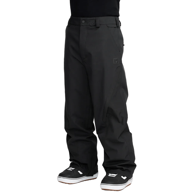 Black Volcom Kleveland snowboard pants featuring a relaxed fit, belt loops, and side pockets in a three-quarter view.