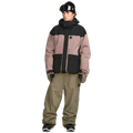 Front view of baggy olive green Volcom Kleveland Snowboard Pants on a model wearing a mauve and black jacket.