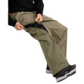 Olive green Volcom Kleveland snowboard pants with a zippered mesh-lined inner thigh vent for airflow.