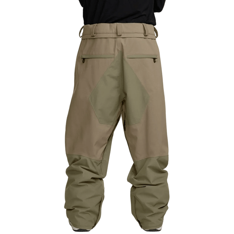 Back view of tan and olive Volcom Kleveland snowboard pants with zippered pockets and reinforced seat panel.