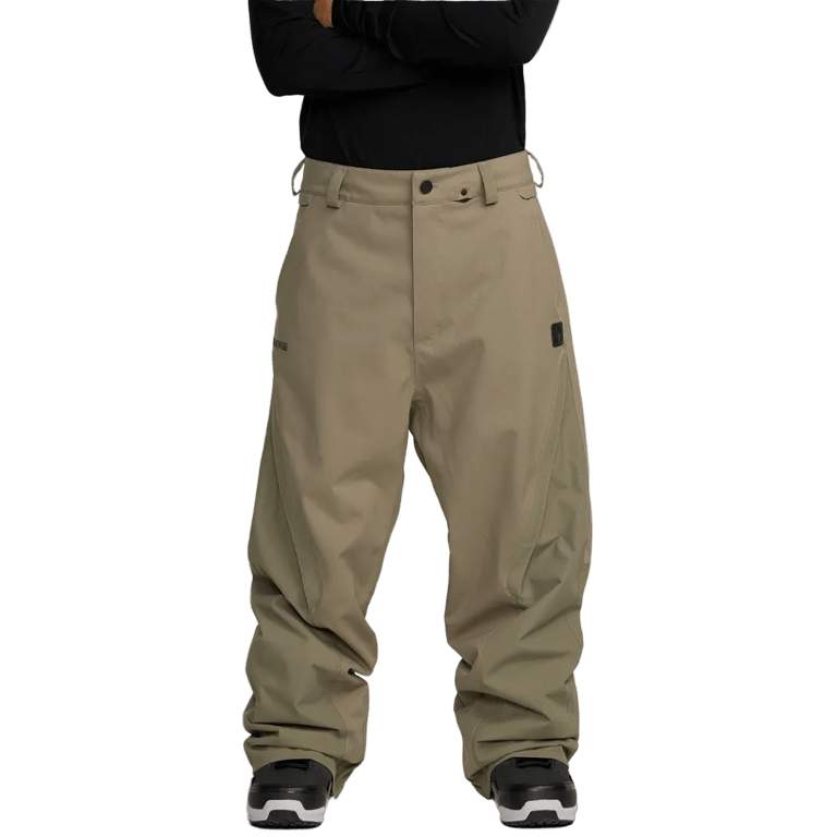 Volcom Kleveland Snowboard Pants in tan, front view, loose fit with belt loops and button fly.