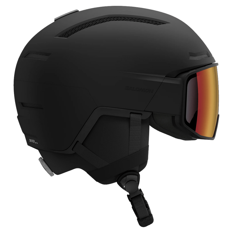 Matte black Salomon Driver Pro ski helmet with integrated red visor and ventilation, side profile view.