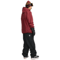 Side profile of black Volcom Longo Gore-Tex snowboard pants with a white star logo, cargo pocket, and elastic cuffs.