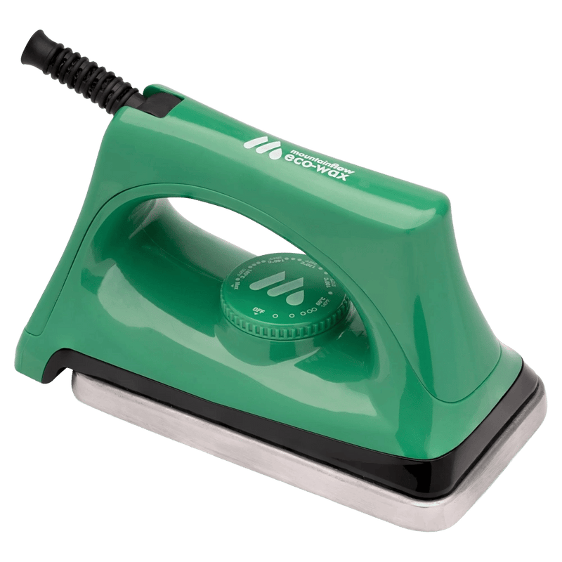 Image of a green iron with a thick base plate and dial tempreture control