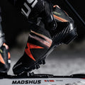 Model foot on ski showing the Madshus Redline Skate X cross country boot attached to the binding
