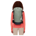 Carried, back view of the Mammut Ducan 24 Backpack in Jade Black colourway, women model