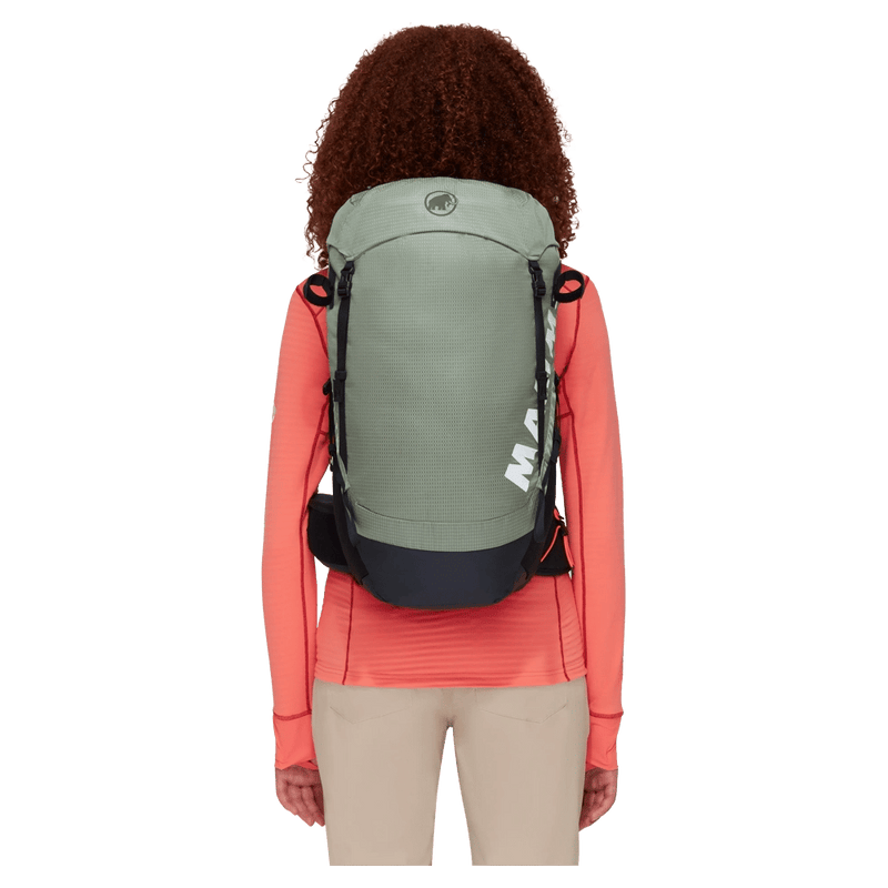 Carried, back view of the Mammut Ducan 24 Backpack in Jade Black colourway, women model