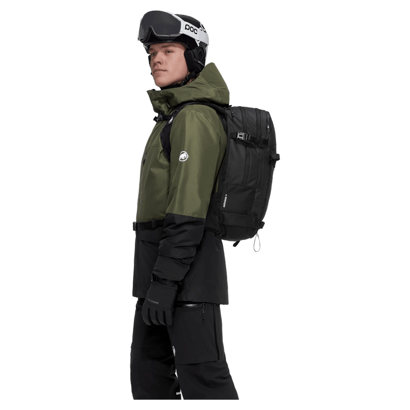 Carried view of the Mammut Nirvana 22L Backpack in black colourway, unisex model