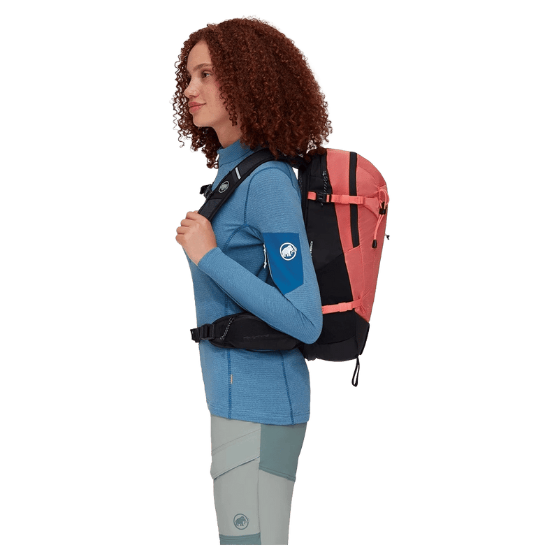 Side view of the Mamut Lithium 15 Backpack in Salmon Black colourway, women's model