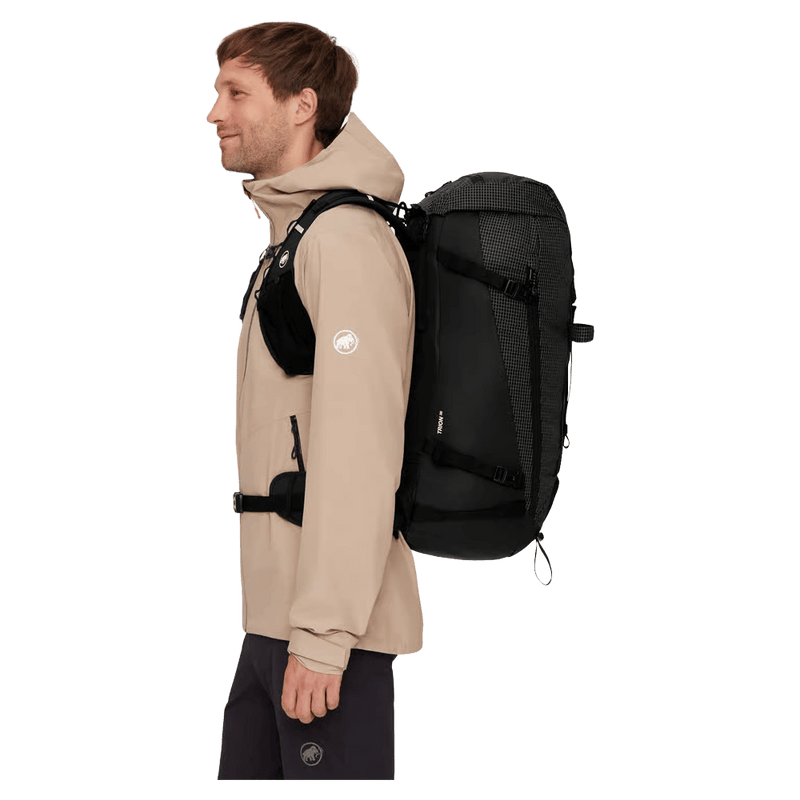 Side view of the Mamut Trion 38L Backpack in Black colourway, unisex's model