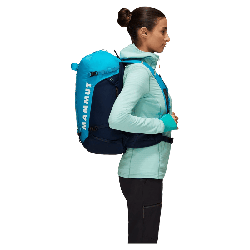 Side view of the Mamut Trion Nordwand 28L Backpack in Sky and Night colourway, women's model