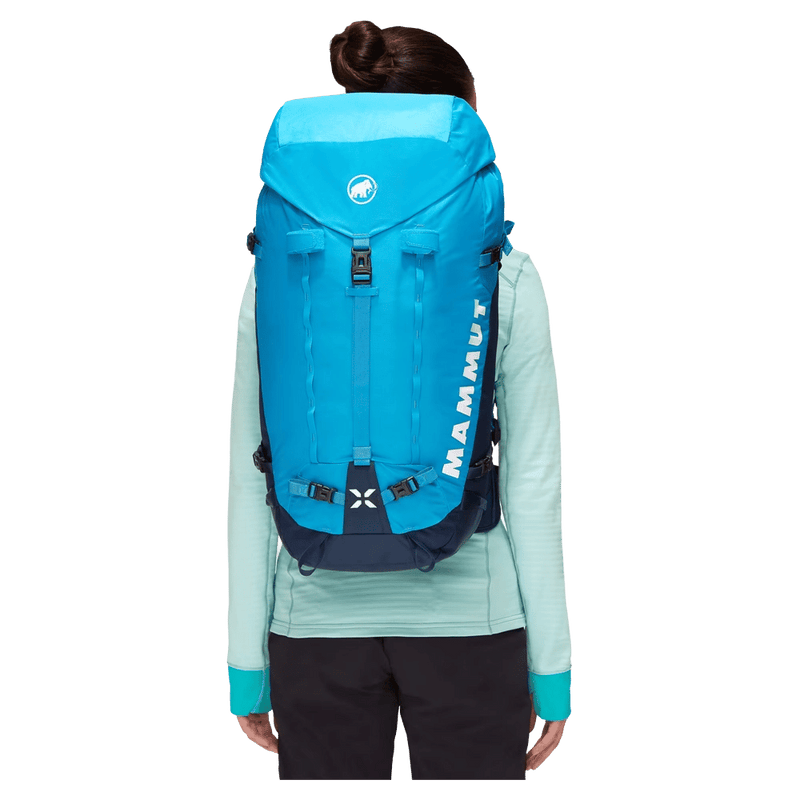 Carried view of the Mamut Trion Nordwand 38L Backpack in Sky and Night colourway, women's model