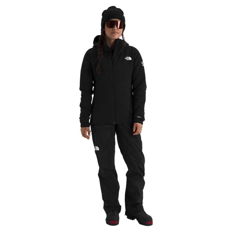 Woman wearing The North Face Summit Casaval Hybrid Hoodie in black, full front zip, hood, small white logo on left chest.