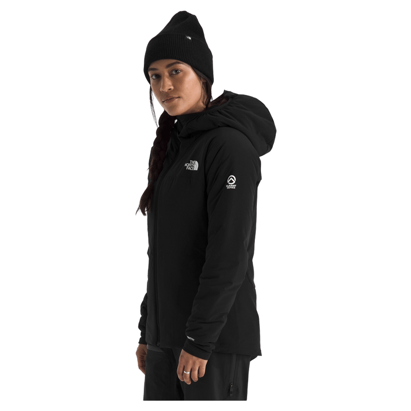 Woman wearing The North Face Summit Casaval Hybrid Hoodie in black, full front zip, hood, small white logo on left chest.