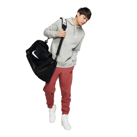 Full lifestyle image of Nike Brasilia Duffel in Black with brand logo in contrast White