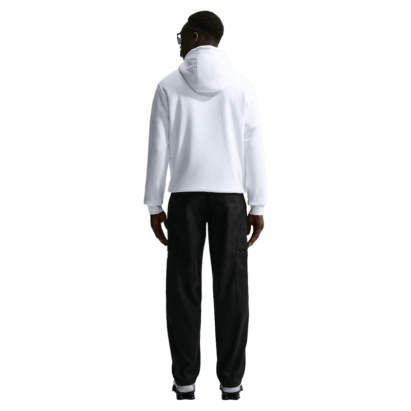 Back view of the Nike Club Cargo Pants in Black colourway, unisex model