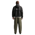 Back view of the Nike Club Cargo Pants in Olive colourway, unisex model