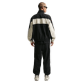Back view of the Nike Club Lightweight Pants in Black and Khaki colourway, men model