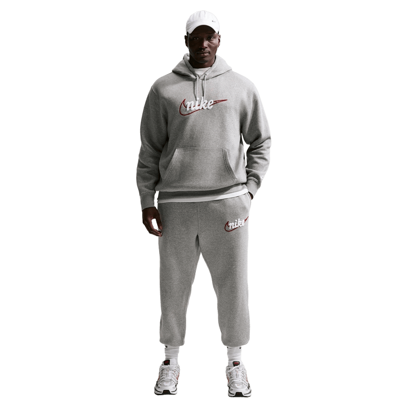 Front view of the Nike Club Track Sweatpants in Dark Grey Heather and light Smoke colourway, men model