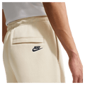 Detail view of the Nike Club Track Sweatpants in Light Khaki and Obsidian colourway, men model