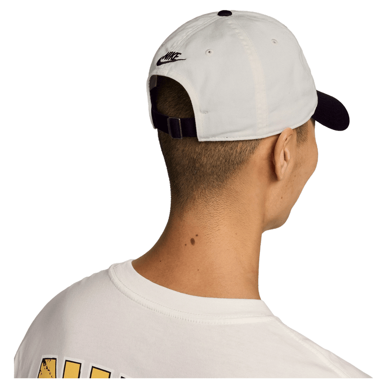 Back view of the Nike Club Cap in Sail and Black colourway, unisex model
