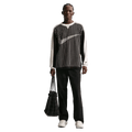 Front view of the Nike Club Pants in Black colourway, unisex model