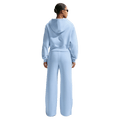 Back view of the Nike Phoenix Fleece Sweatpants in Hydrogen Blue colourway, women model